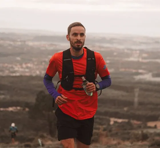 Trail runner wearing a hydration vest